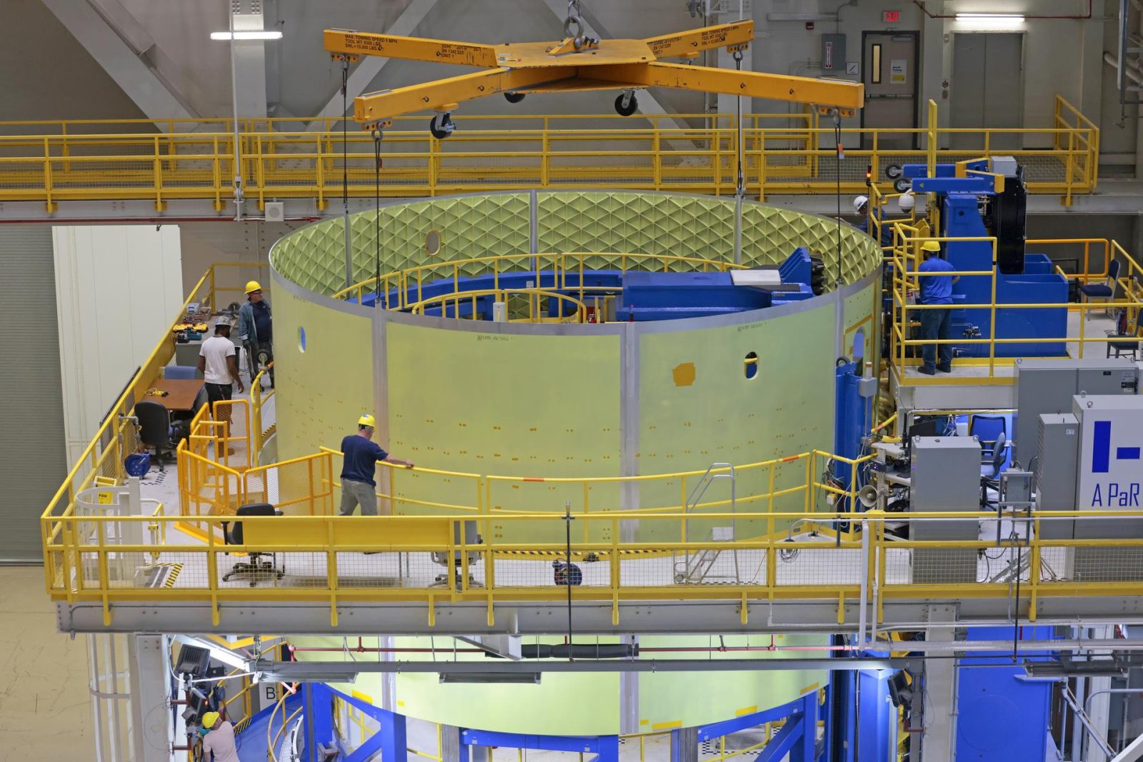 Technicians at NASA’s Michoud Assembly Facility move the engine section of NASA’s Space Launch System rocket for Artemis V on December 18, 2024, at NASA Michoud Assembly Facility in New Orleans, LA.
