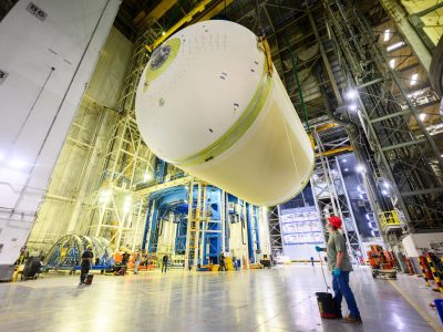 Teams at NASA’s Michoud Assembly Facility in New Orleans lift a liquid oxygen tank from a horizontal to a vertical position and place it into a production cell on July 12.