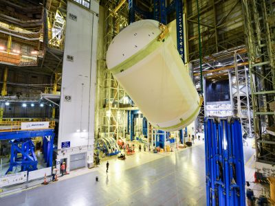 Teams at NASA’s Michoud Assembly Facility in New Orleans lift a liquid oxygen tank from a horizontal to a vertical position and place it into a production cell on July 12.