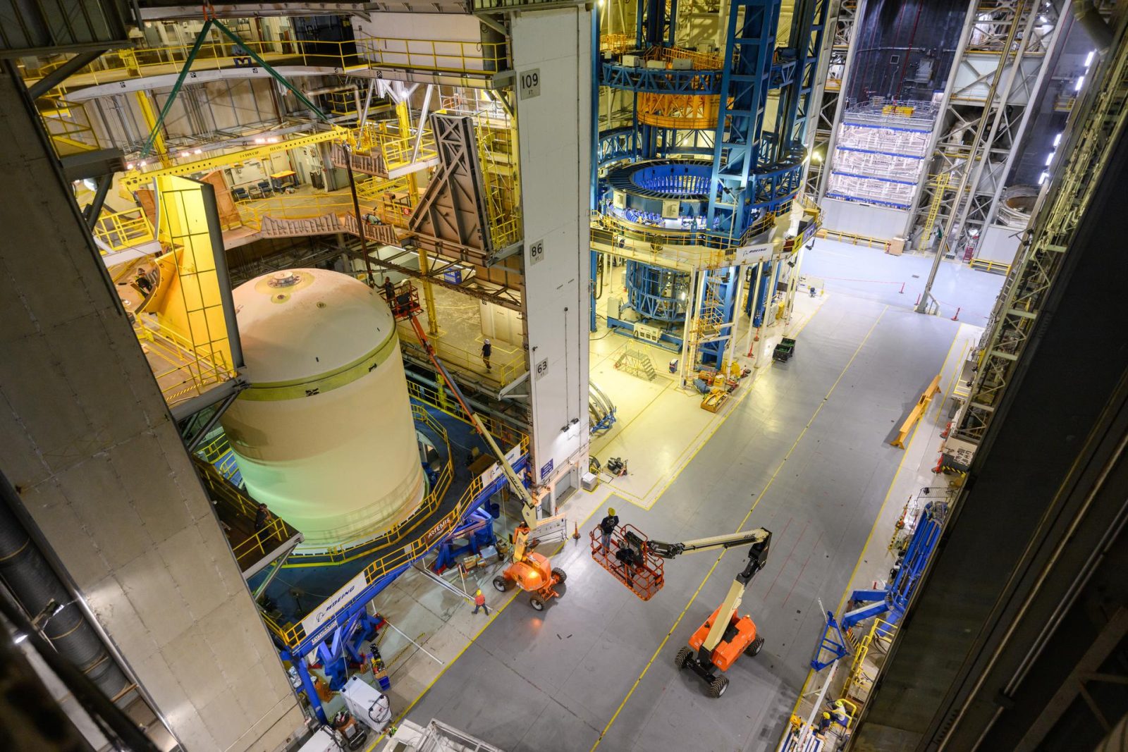 Teams at NASA’s Michoud Assembly Facility in New Orleans lift a liquid oxygen tank from a horizontal to a vertical position and place it into a production cell on July 12.