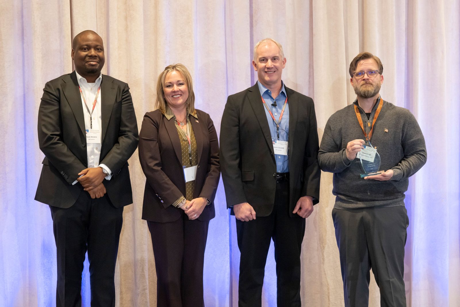 BAE Systems’ Combat Mission Systems Future Tech Works Supplier Of The Year (SOY) Award presentation photo at the seventh annual ‘Partner2Win’ supplier symposium.